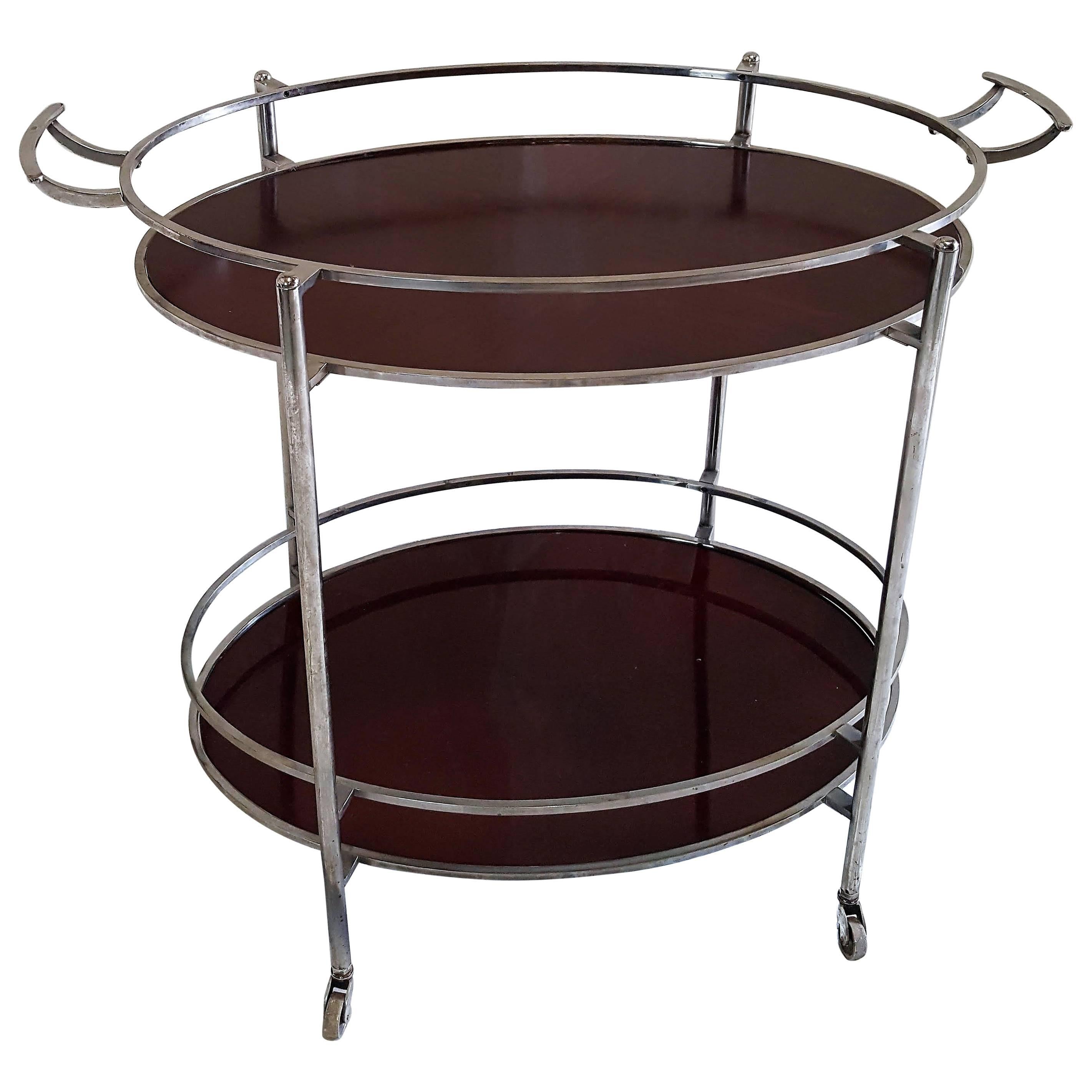 Mid-Century Oval Polished Stainless Steel and Chrome Cherry Wood Bar Cart For Sale