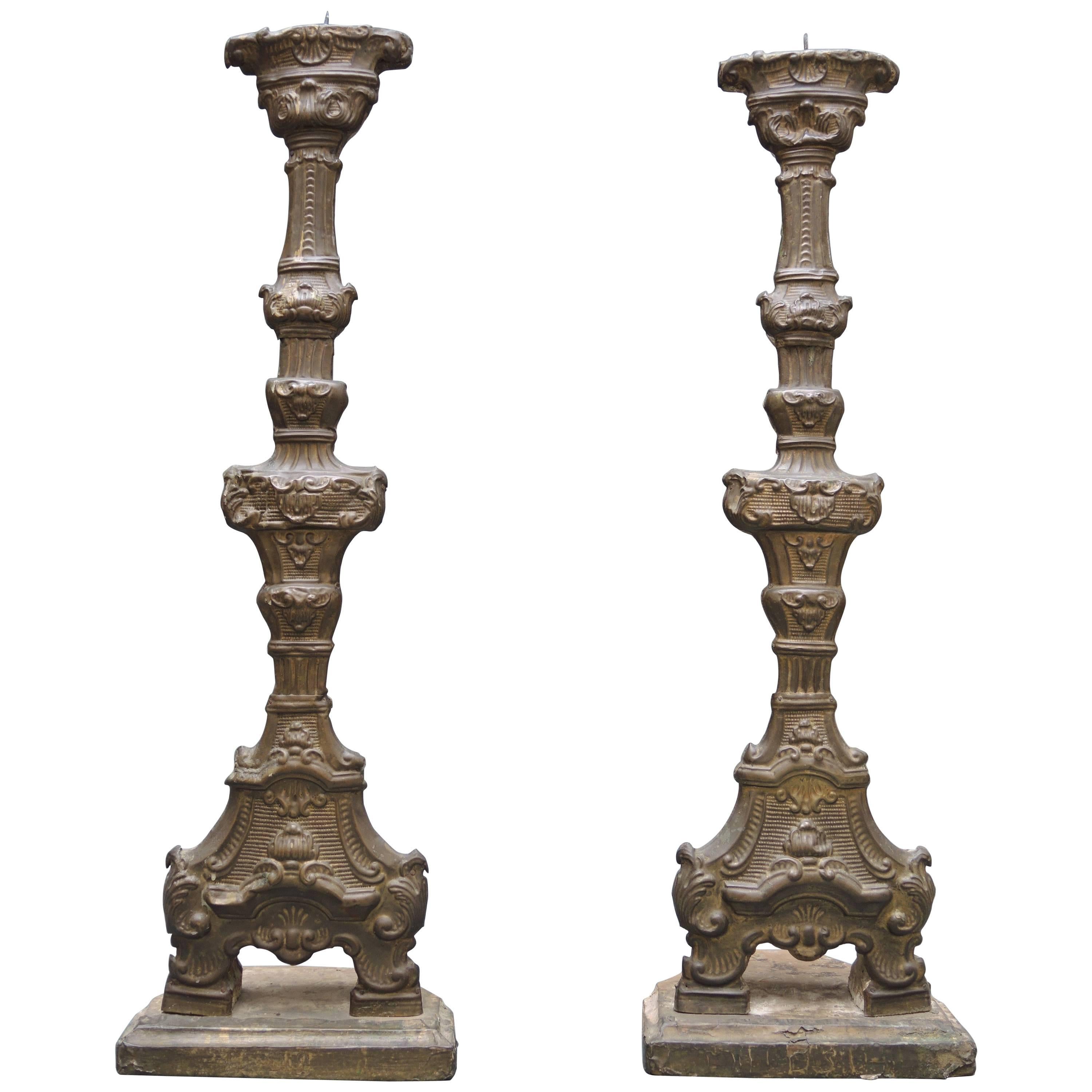 Pair of 18th Century  Italian Altar Candlesticks in Repousse Brass And Wood For Sale