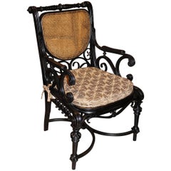 Anglo Raj Ebonized Bentwood Armchair with Caned Seat and Back