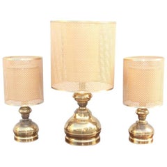 Triptych of Brass Lamps with Thatched Dome