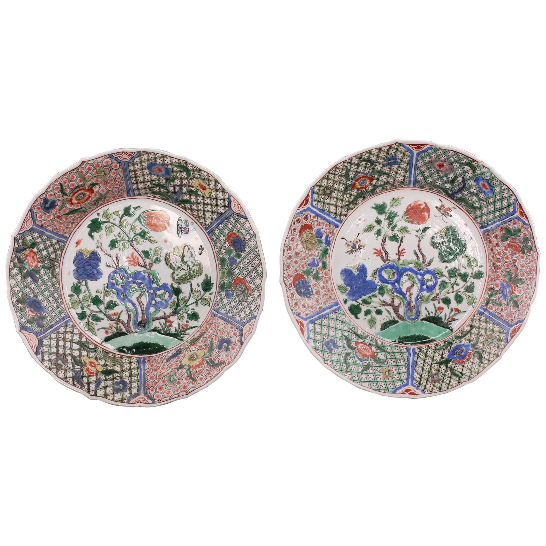 Chinese Porcelain Pair of Plates, Plants, Rockwork, Butterflies, Flowers, Kangxi For Sale