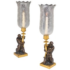 Pair of Regency Wood and Caldwell Pottery Triton Bronzed Storm Lamps