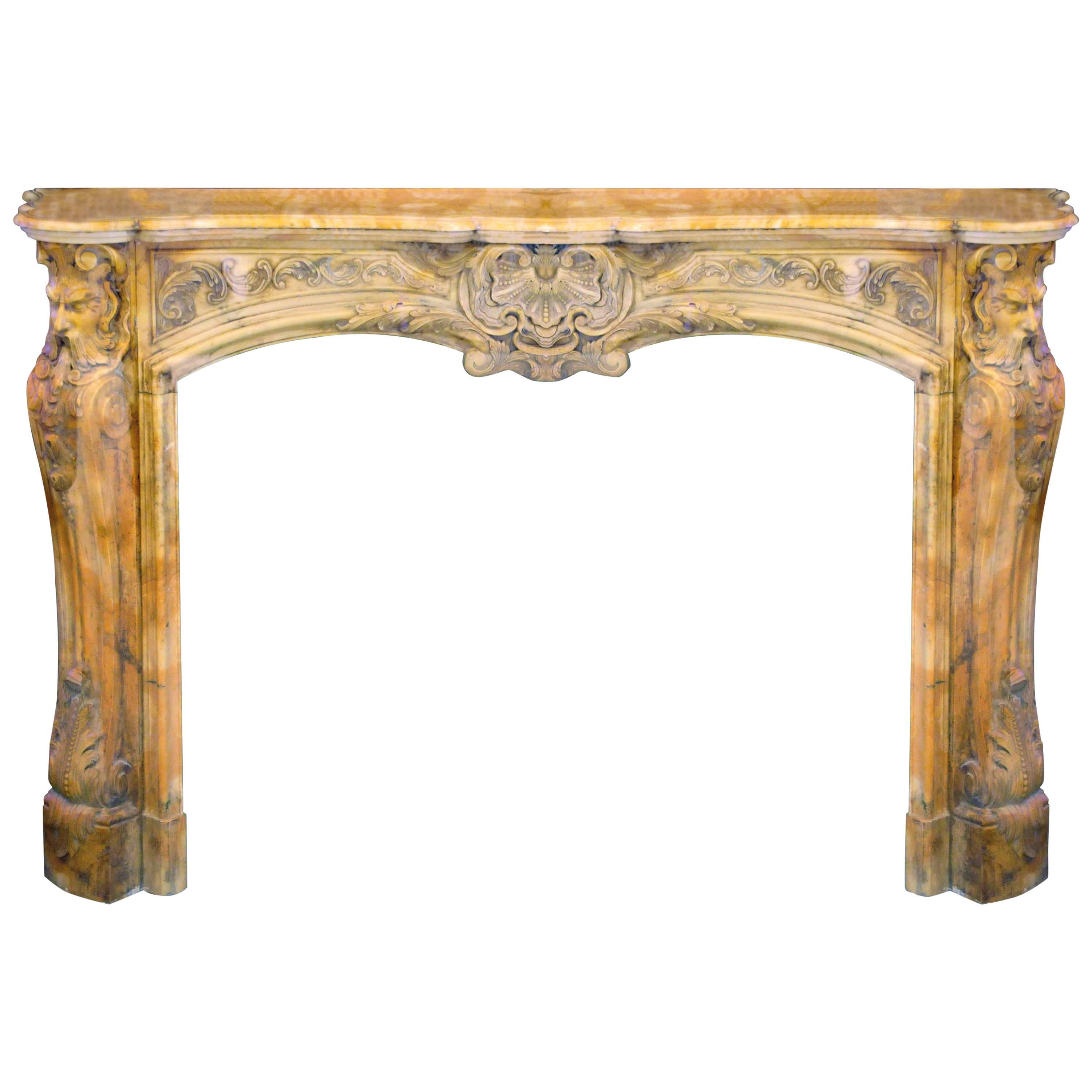 Sculpted Louis XV Style Fireplace in Yellow Marble For Sale