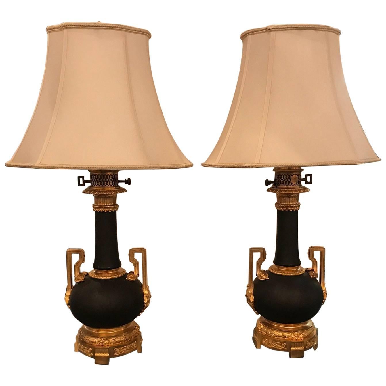 Pair of French Patinated Bronze Oil Lamps with Ormolu Mounts