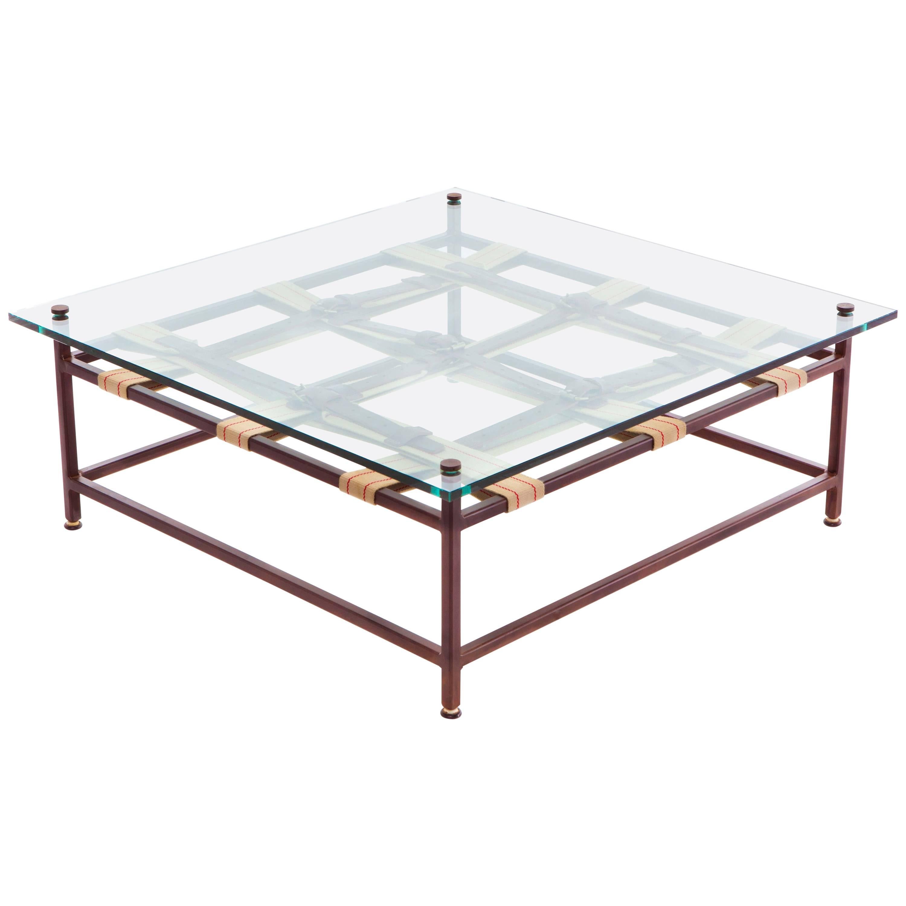 Glass and Marbled Rust Coffee Table with Swiss Military and Oxblood Belts For Sale