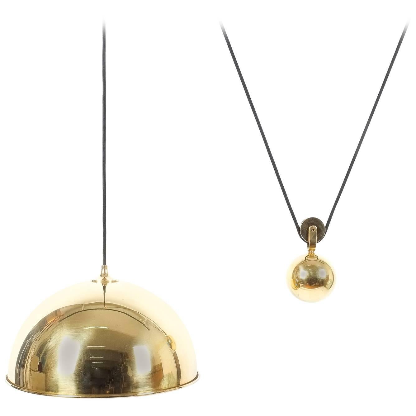 Adjustable Refurbished Brass Counterweight Pendant Lamp by Florian Schulz For Sale