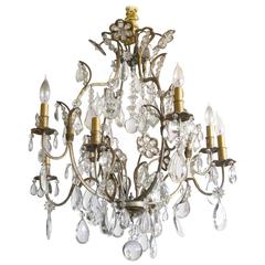 Hollywood Regency Gilt Decorated Wrought Iron and Crystal Eight-Arm Chandelier 9