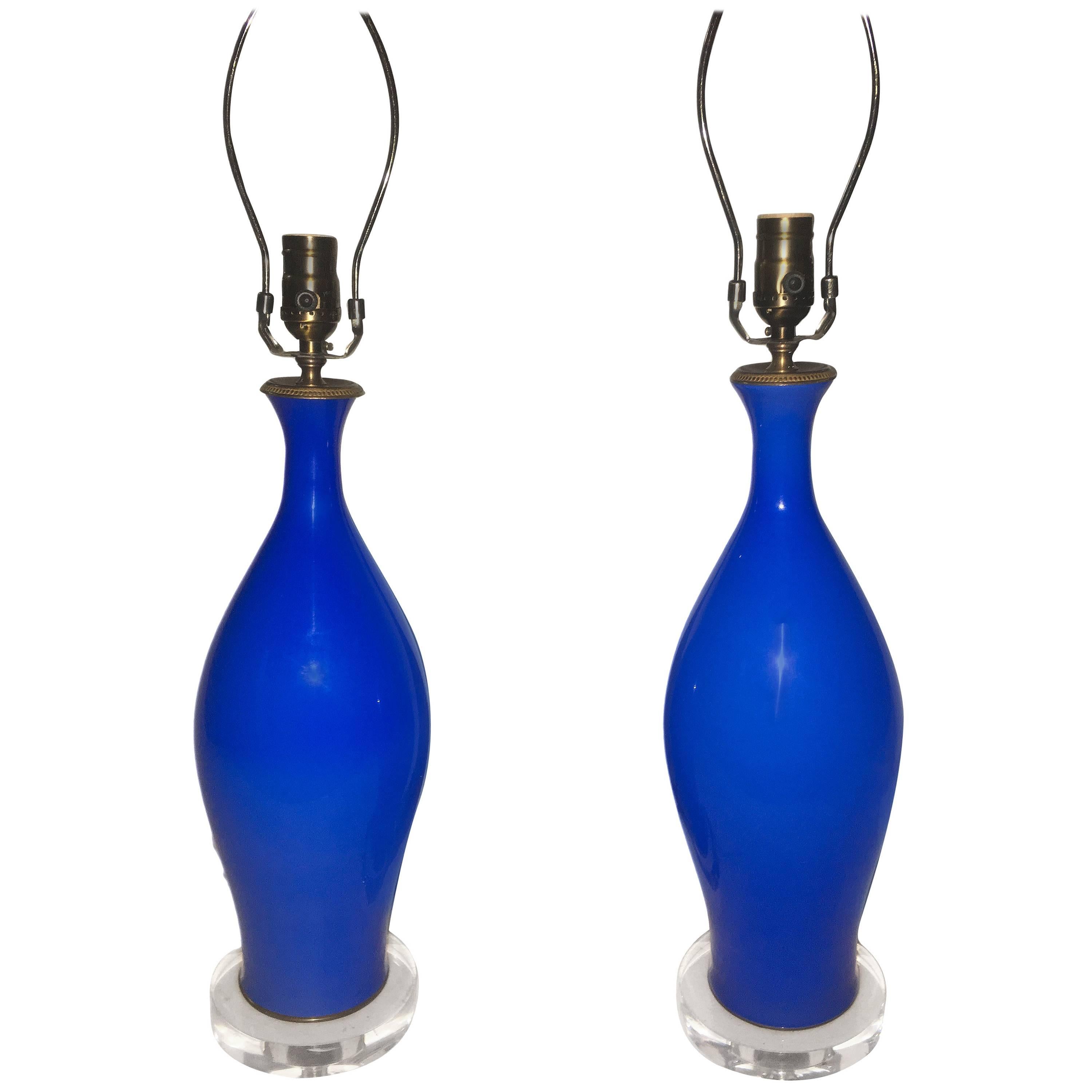 Pair of circa 1960’s Italian blue opaline table lamps with lucite bases.

Measurements:
Height of body: 18