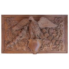 Antique Open Wings Oak Eagle Seated on a Coat of Arms in a Wall Panelling