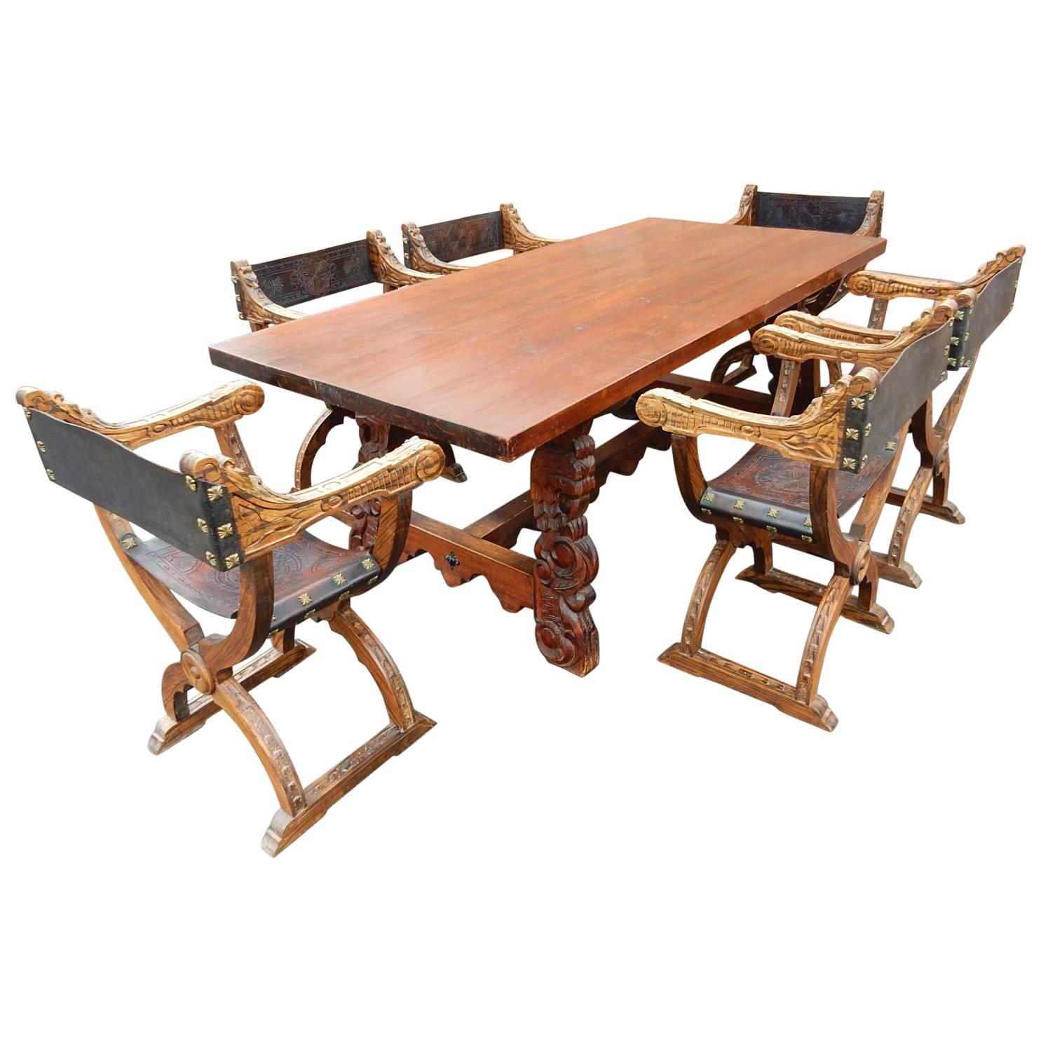 Spanish Colonial Dining Table with Six Elaborate Carved Wood and Leather Chairs