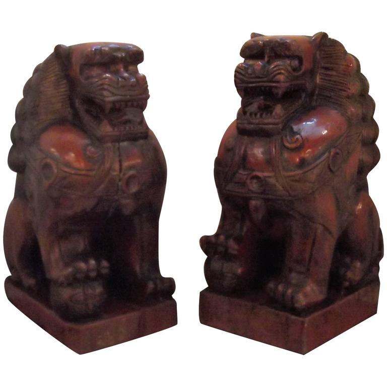 Pair of Cinnabar Lacquered Carved Wood Foo Dogs For Sale at 1stDibs