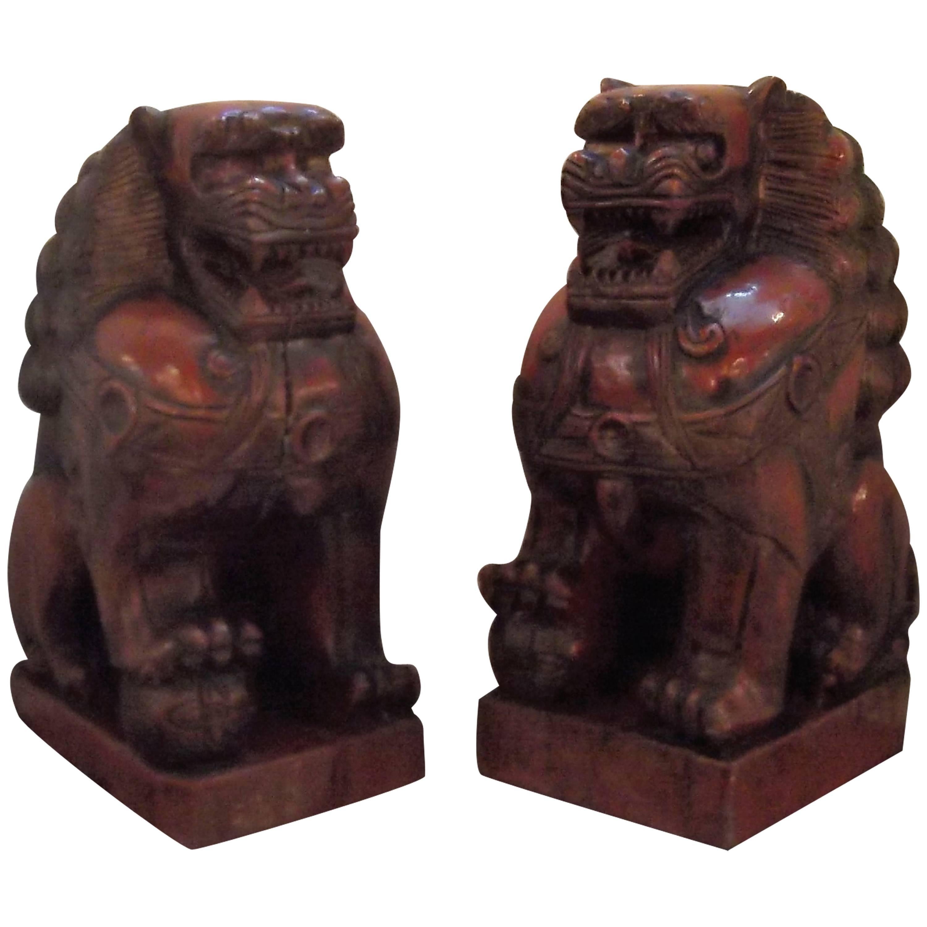 Pair of Cinnabar Lacquered Carved Wood Foo Dogs