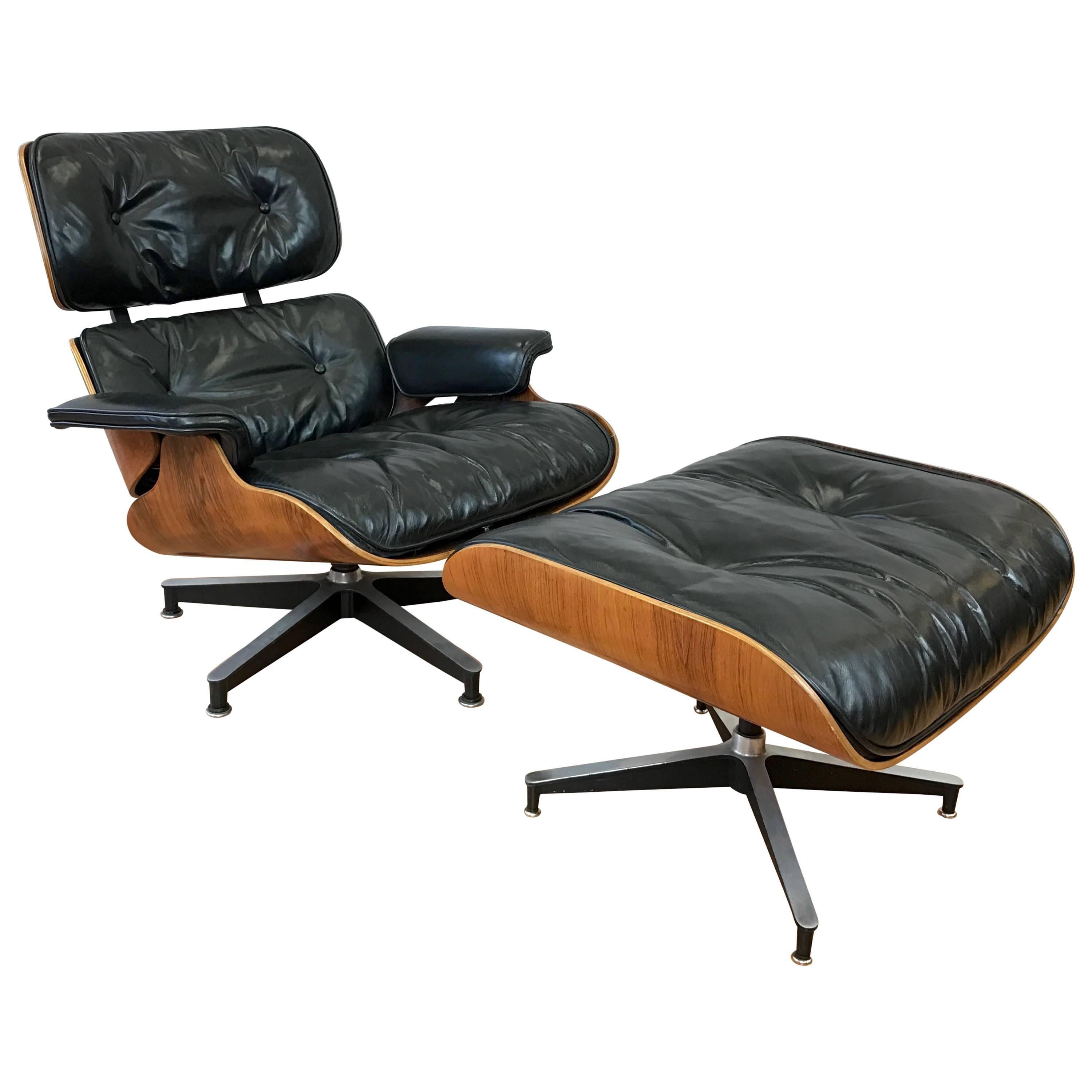 Vintage Eames Model 670 Lounge Chair & Ottoman in Rosewood and Black Leather