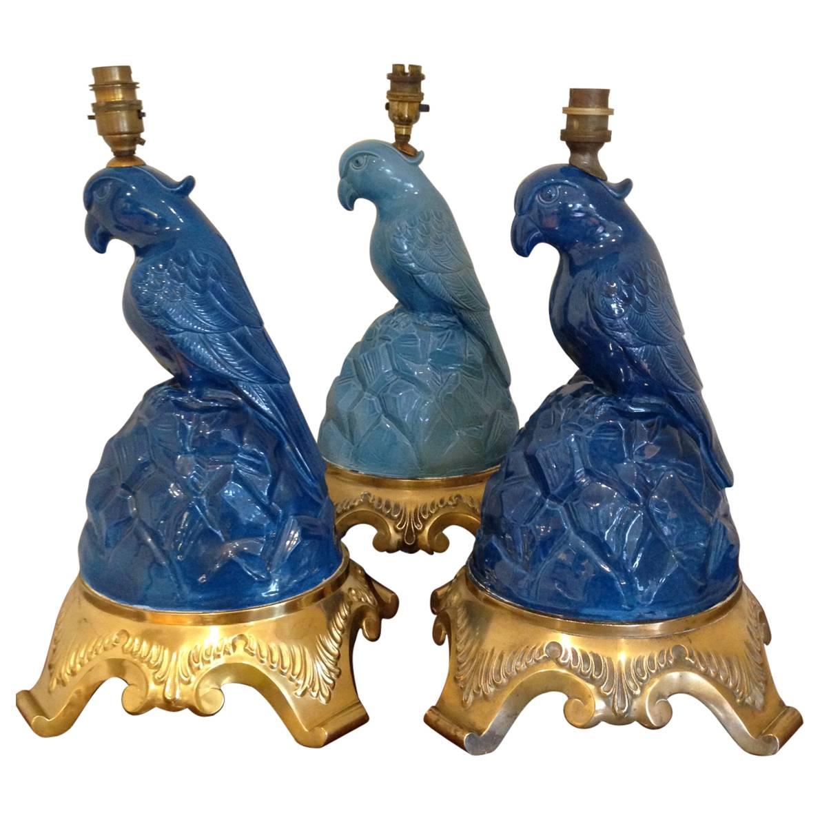 Set of Three Fabulous Glazed Blue Porcelain Parrot Lamps on Gilt Bronze Mounts