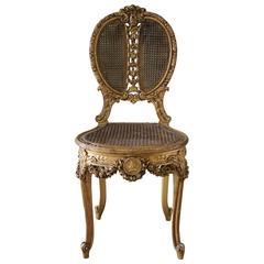 19th Century Louis XV Style Cane and Carved Giltwood French Chair