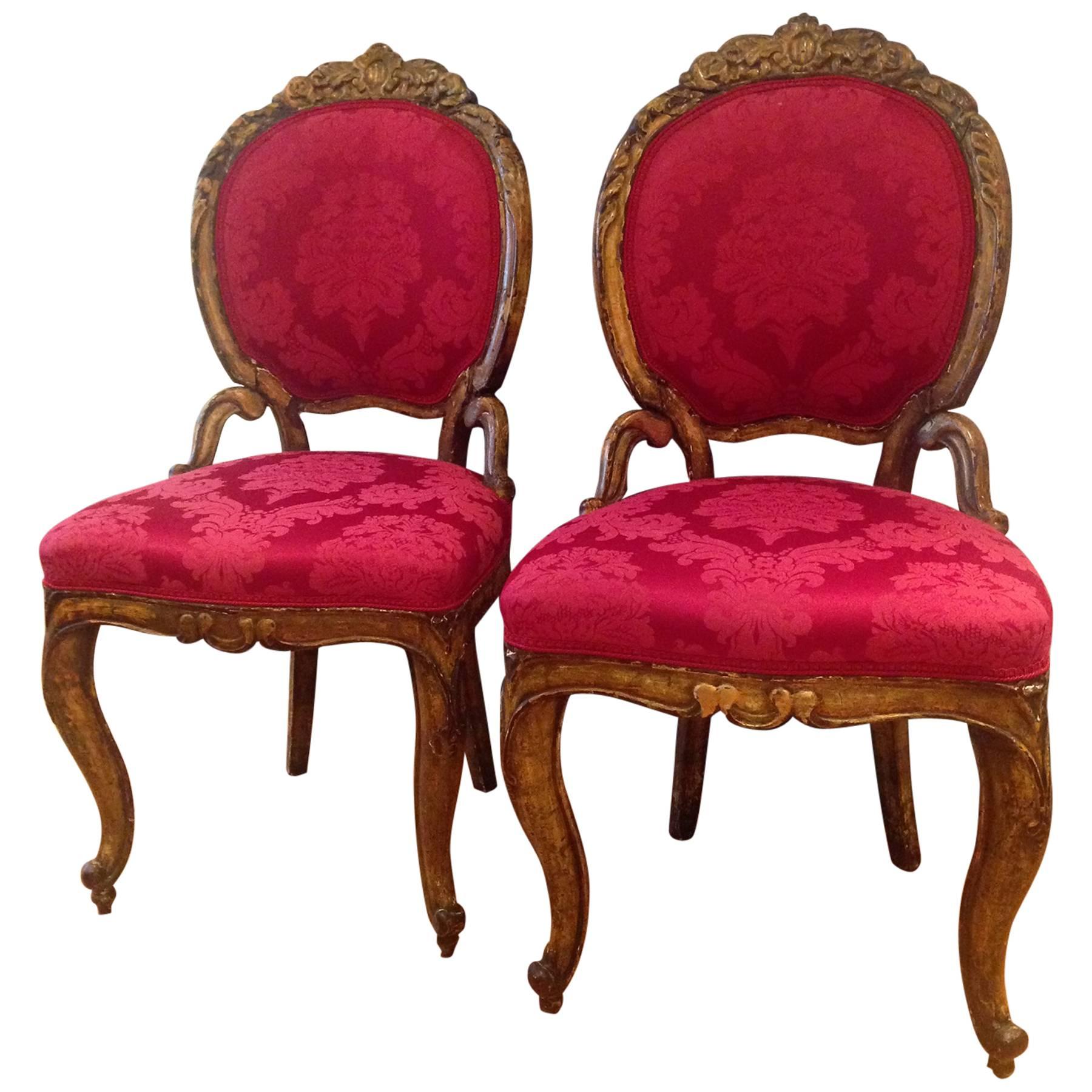 Pair of 18th Century Italian Baroque Giltwood Chairs Upholstered in Damask For Sale