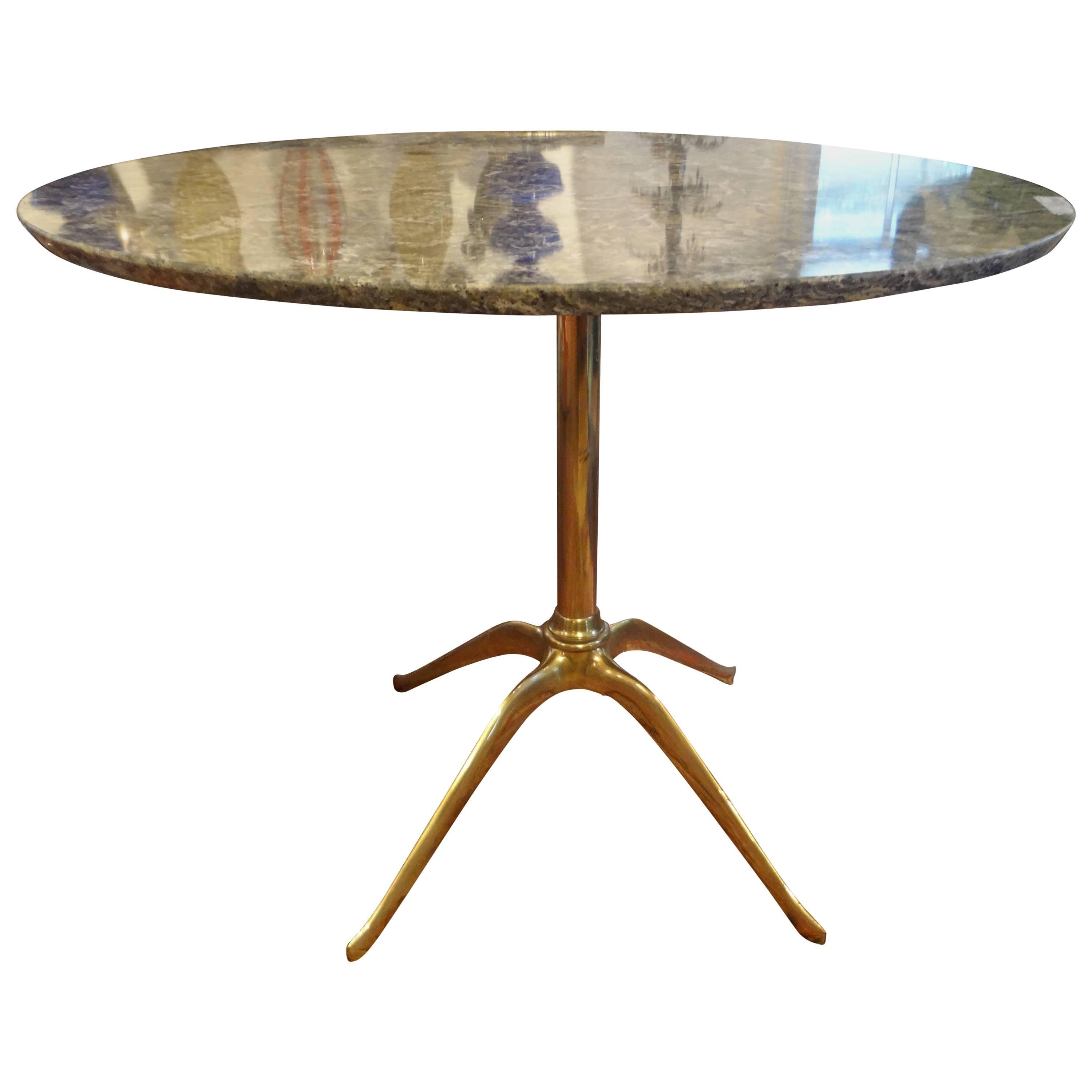 Italian brass Mid-Century Modern centre or dining table with marble top inspired by Gio Ponti From Milan, circa 1950.