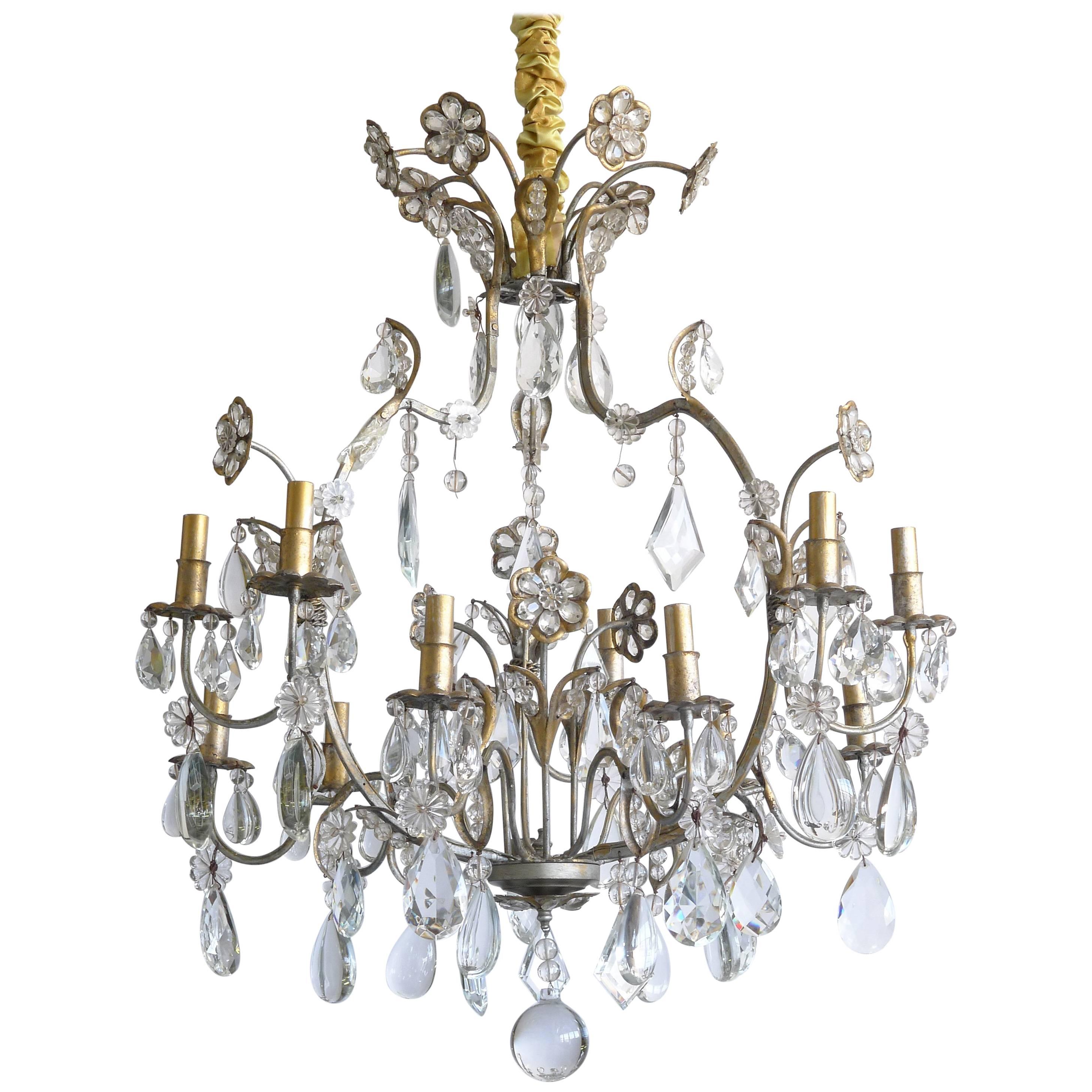 Hollywood Regency Gilt Decorated Wrought Iron and Crystal Twelve-Arm Chandelier For Sale