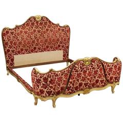 20th Century Venetian Lacquered and Gilt Bed Covered in Red Floral Fabric