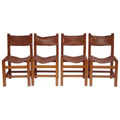 1970s French Set of Four Solid Elm and Leather Dining Chairs by Maison Regain