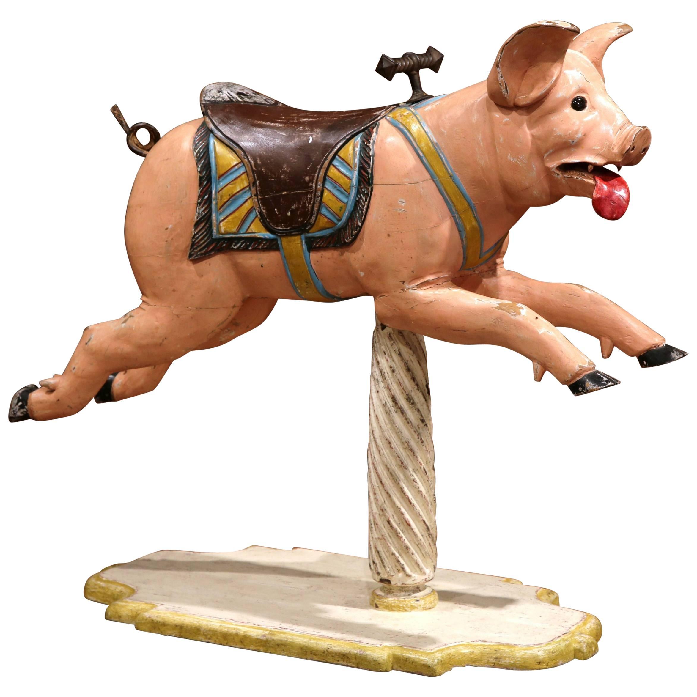 Incorporate old world charm into your home with this interesting antique, wooden carousel pig sculpture from France, circa 1890. The large pig sculpture sits on a barley twist post, and is decorated with its original polychrome painted finish and