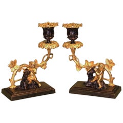 Pair of 19th Century Bronze and Ormolu Cherub and Ram Candlesticks