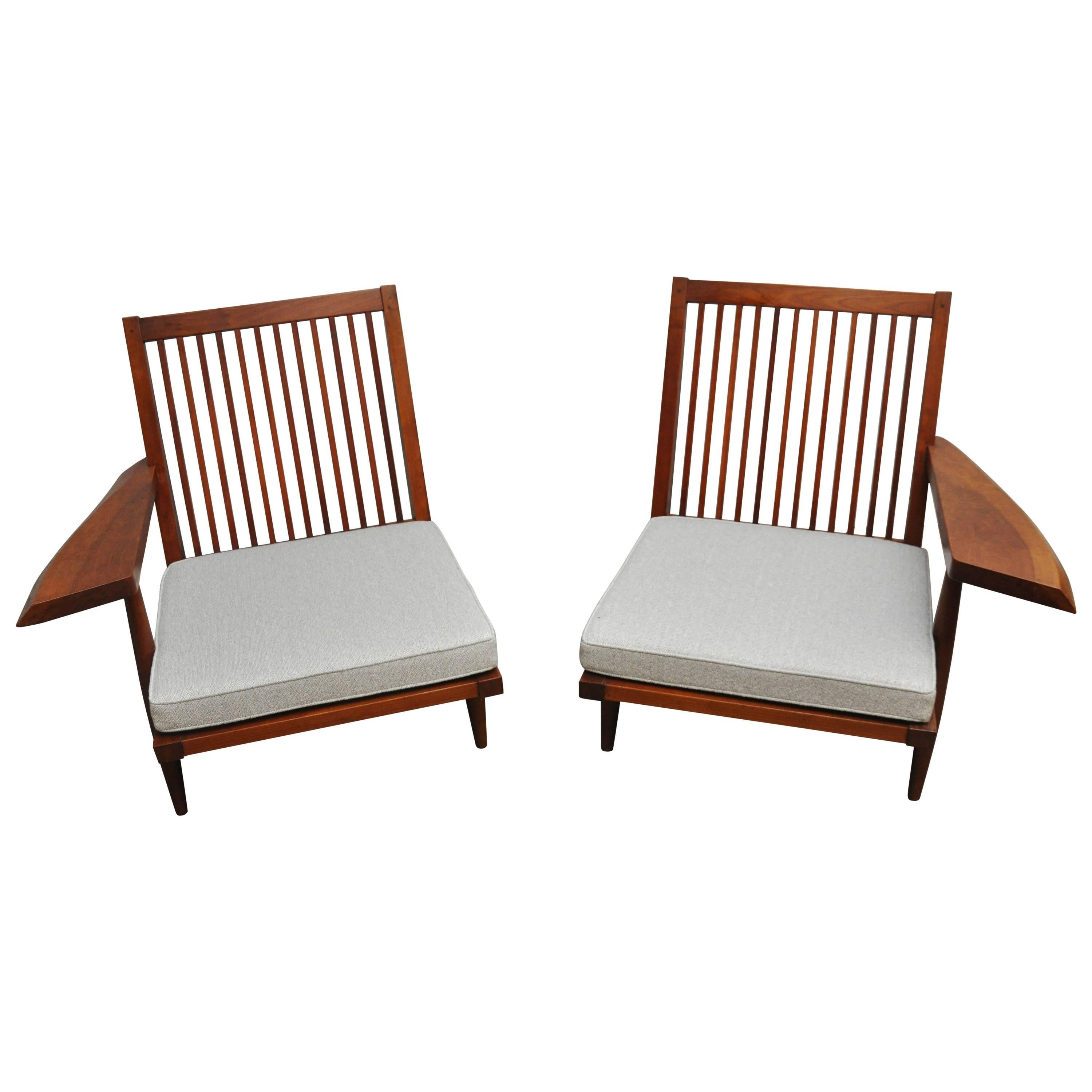 Rare custom ordered pair of cherry spindle back lounge chairs with live edge arms by George Nakashima, circa 1955 with provenance and original receipt. New cushions.
