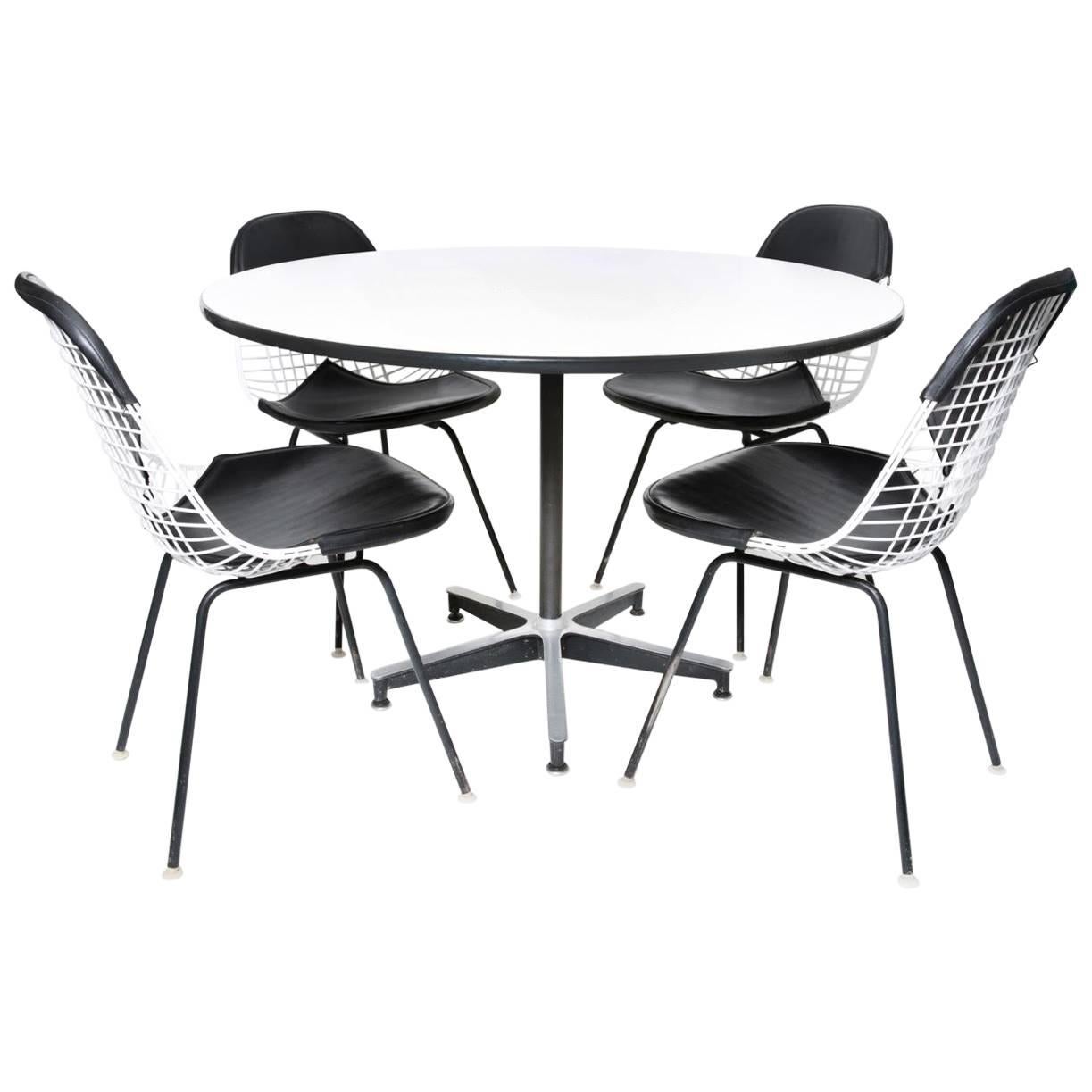 Herman Miller Eames Dining Table and Four Chairs