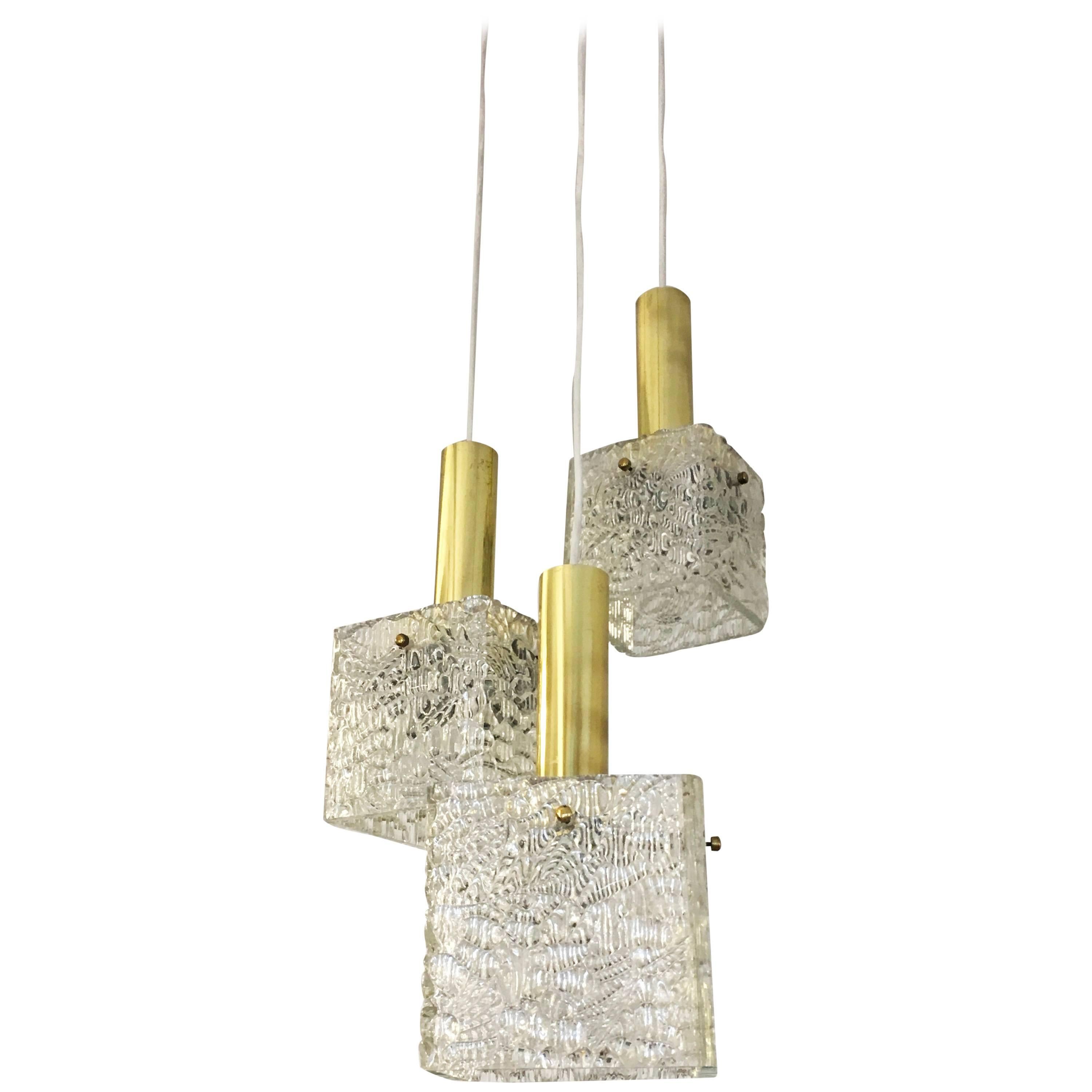 Cascading Textured Glass and Brass Chandelier by J.T. Kalmar For Sale