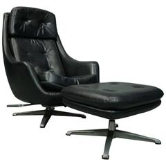 Mid-Century Modern Eames Style Black Swivel Shell Chair and Ottoman, circa 1960