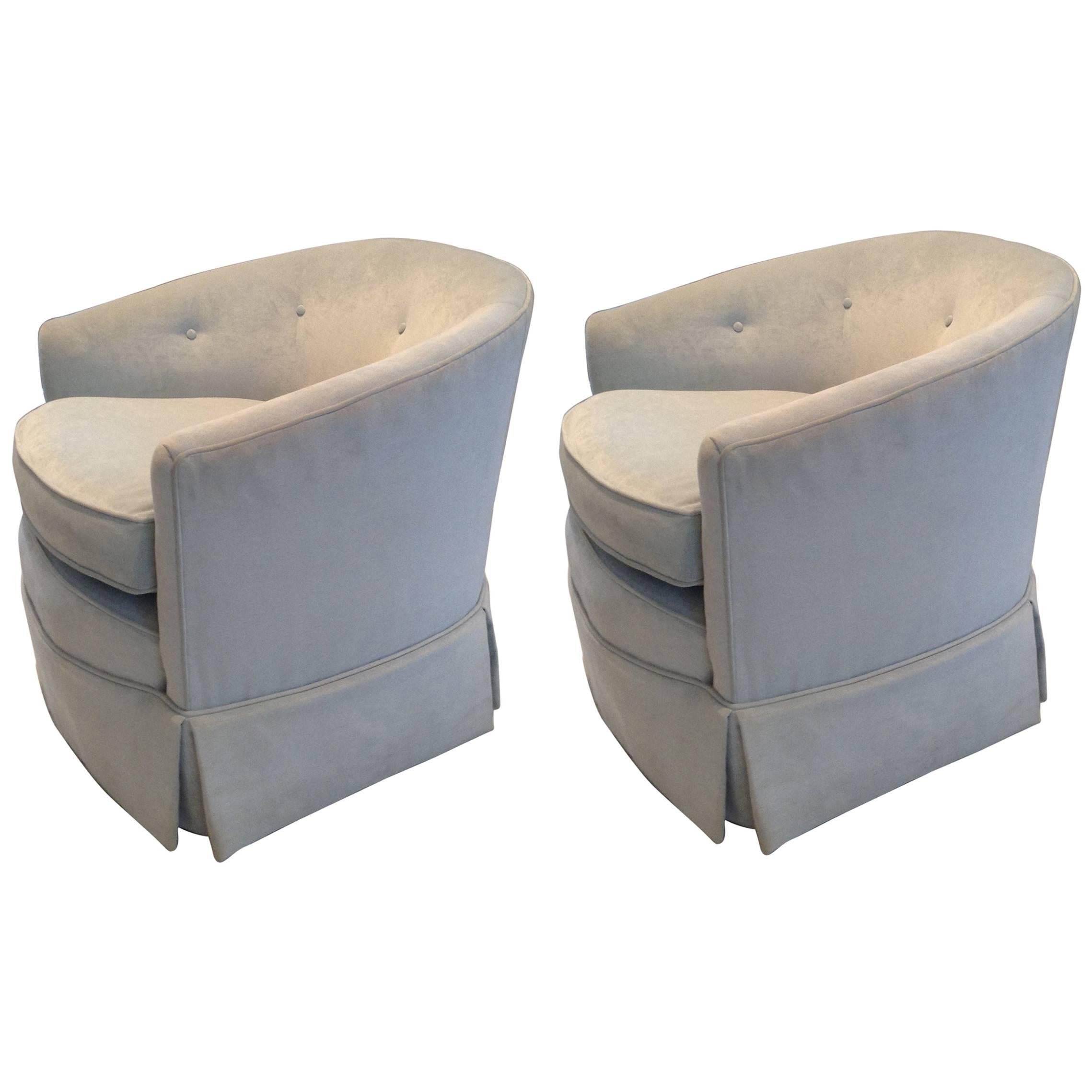 Pair of elegant silk velvet swivel tub chairs newly upholstered in the palest shade of blue. Loose seat cushion with tight tufted back; each is on casters. 

 