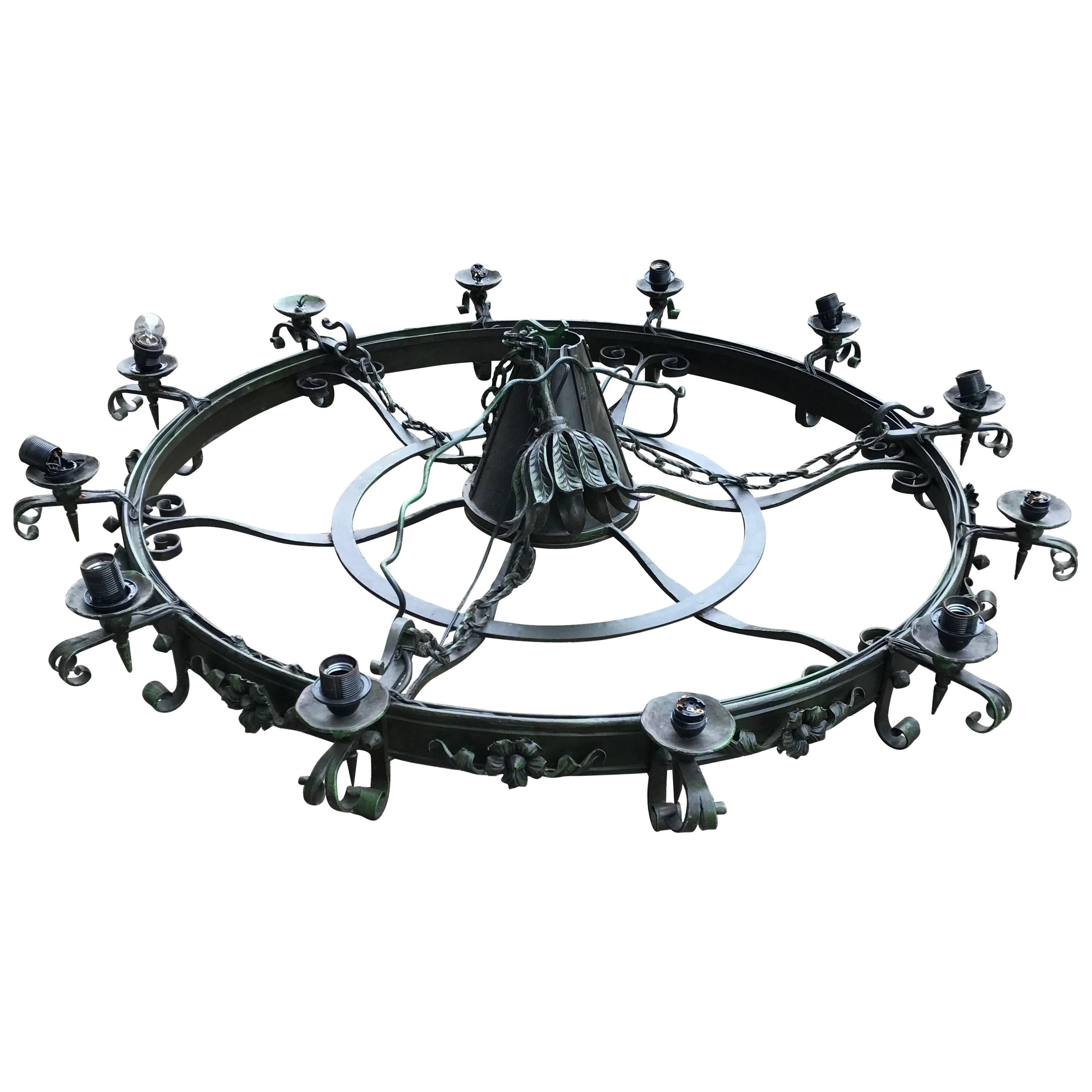 Enormous Crafted Wrought Iron Chandelier w. 12 Torch Lights and One Centre Light For Sale