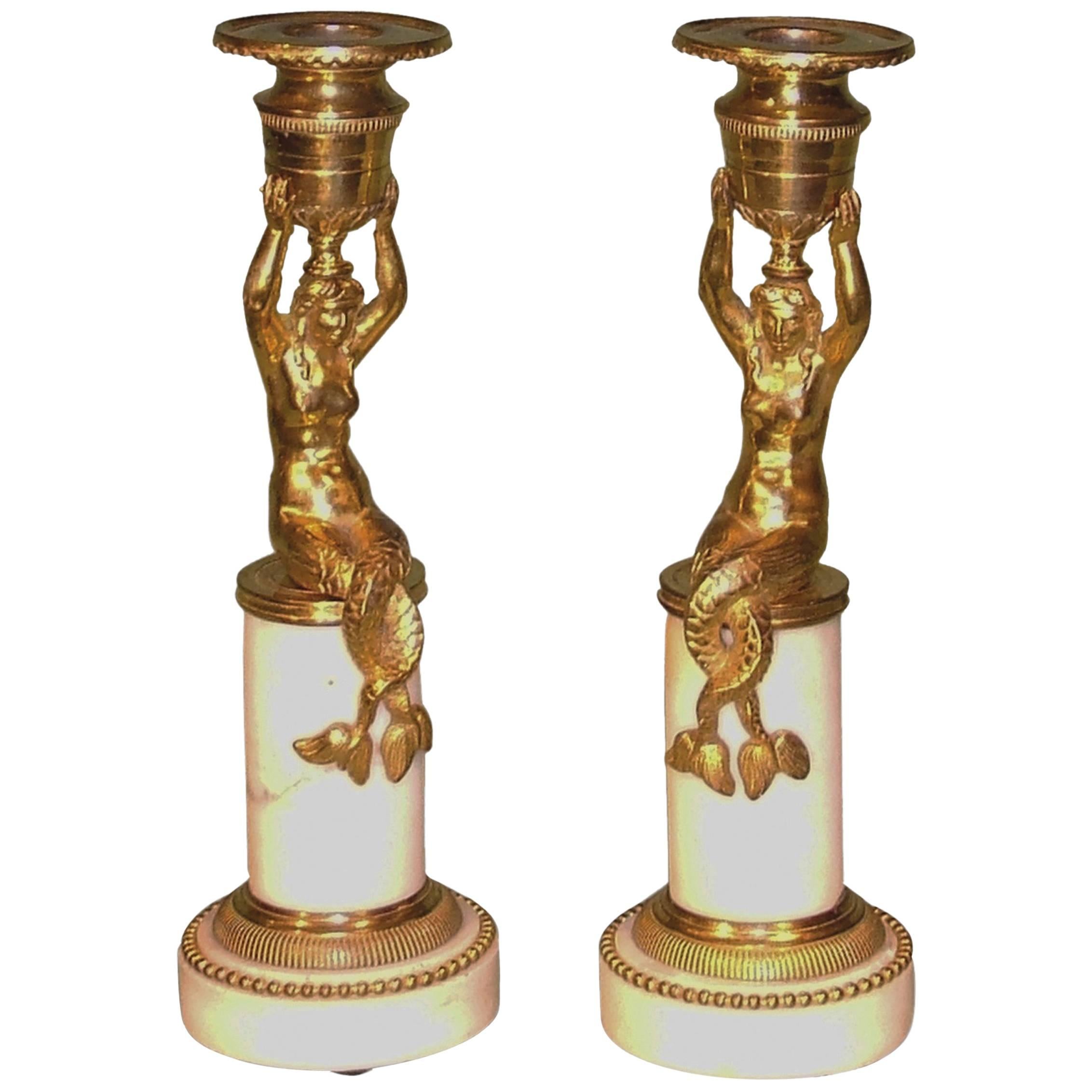 Paire de bougeoirs sirènes en bronze doré d'époque Régence