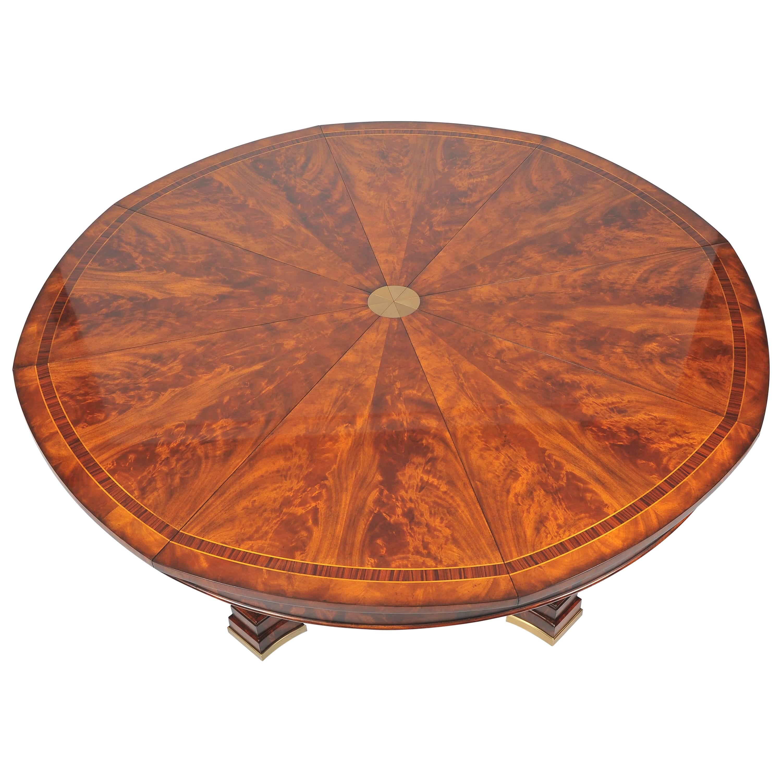 This stunning and high polished mahogany circular dining table features a state of the art extending metal mechanism which allows the table to open up to an additional 24 in-61 cm. The table measures 67 ¼ in-171 cm in diameter when closed and opens