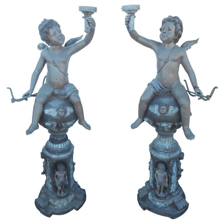 Impressive Pair of Bronze Statues Holding a Light Fixture For Sale at