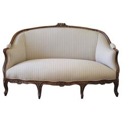 19th Century Walnut Rose Carved Settee Upholstered in Stripe Linen