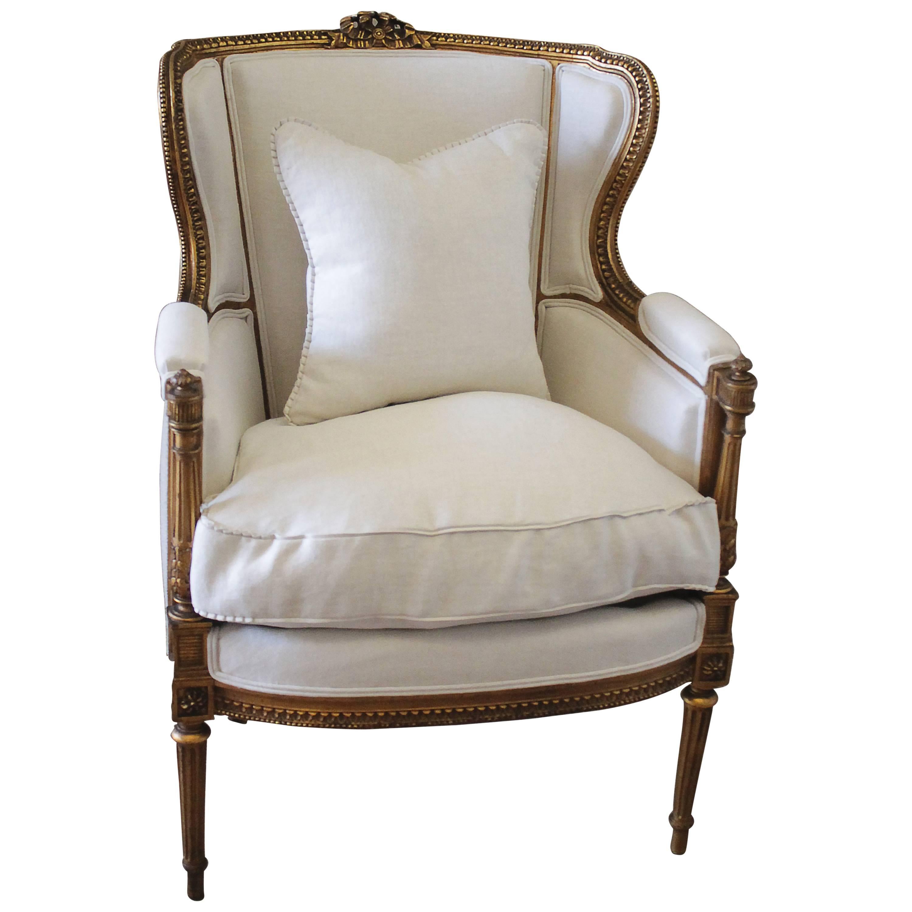 Antique Louis XVI Style Gilt French Wing Chair with Linen Upholstery