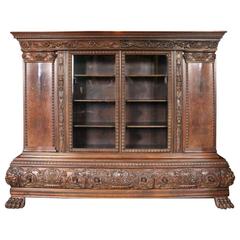 Antique Monumental Carved German Baroque Walnut and Burl four-Door three-Drawer Bookcase