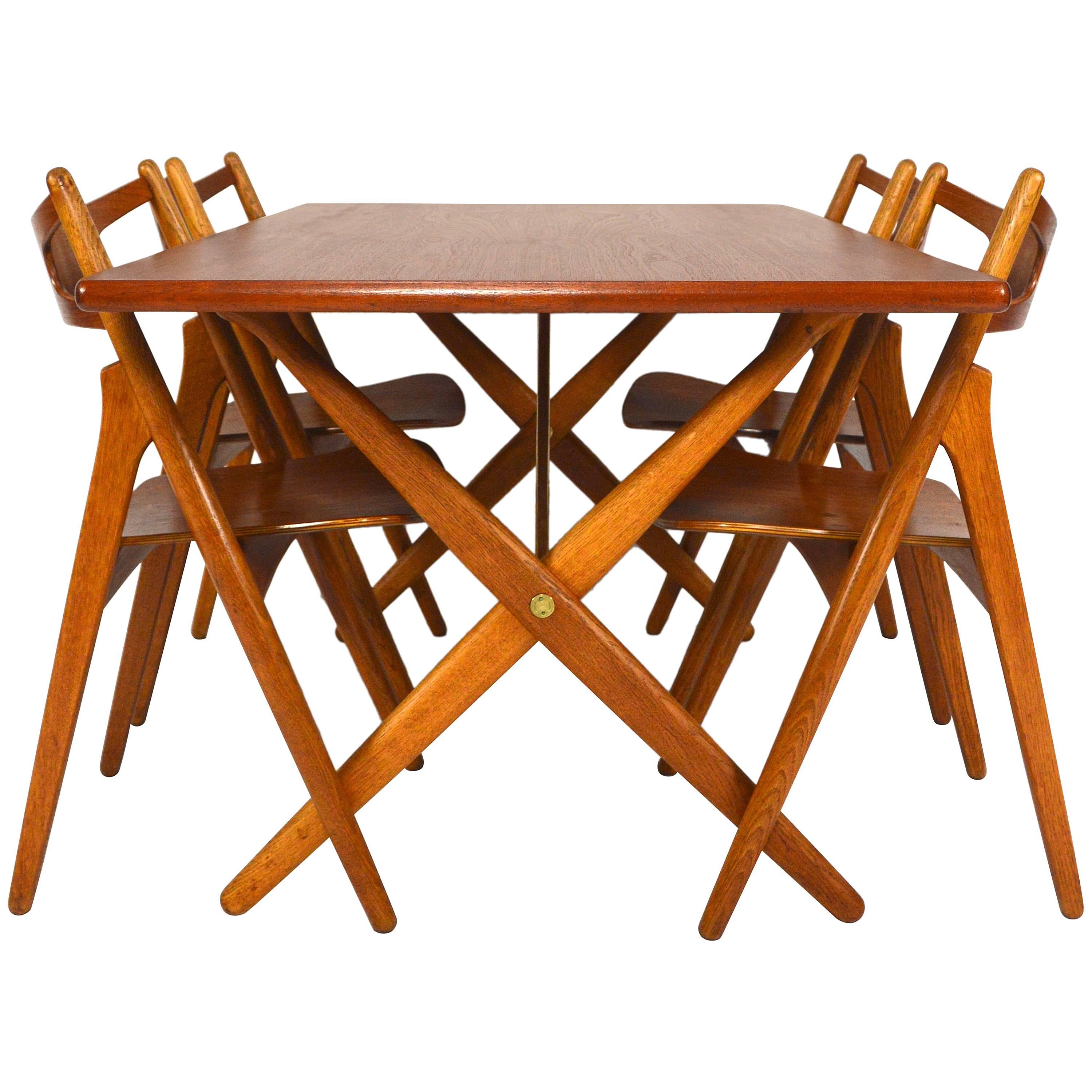 Hans J. Wegner Dining Set Table AT303 and Sawbuck Chairs
