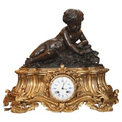 Antique Large 19th Century Gilt Bronze Clock with Patinated Putto Mounted on the Top