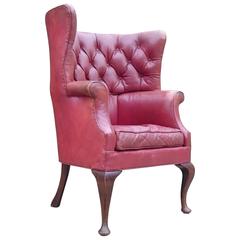 Button Back Barrel Back Leather Wing Chair by Howard and Sons of London