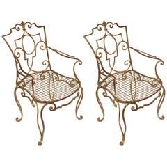 Flamboyant Pair of Jean- Charles Moreux Gilded Armchairs