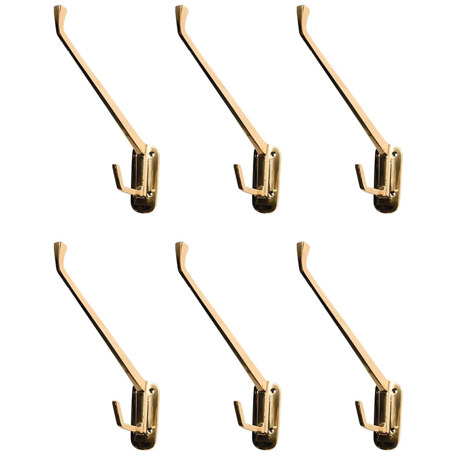 Six Art Deco Brass Wall Hooks