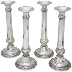 Suite of Four Tall Sterling Silver Neoclassical Candlesticks