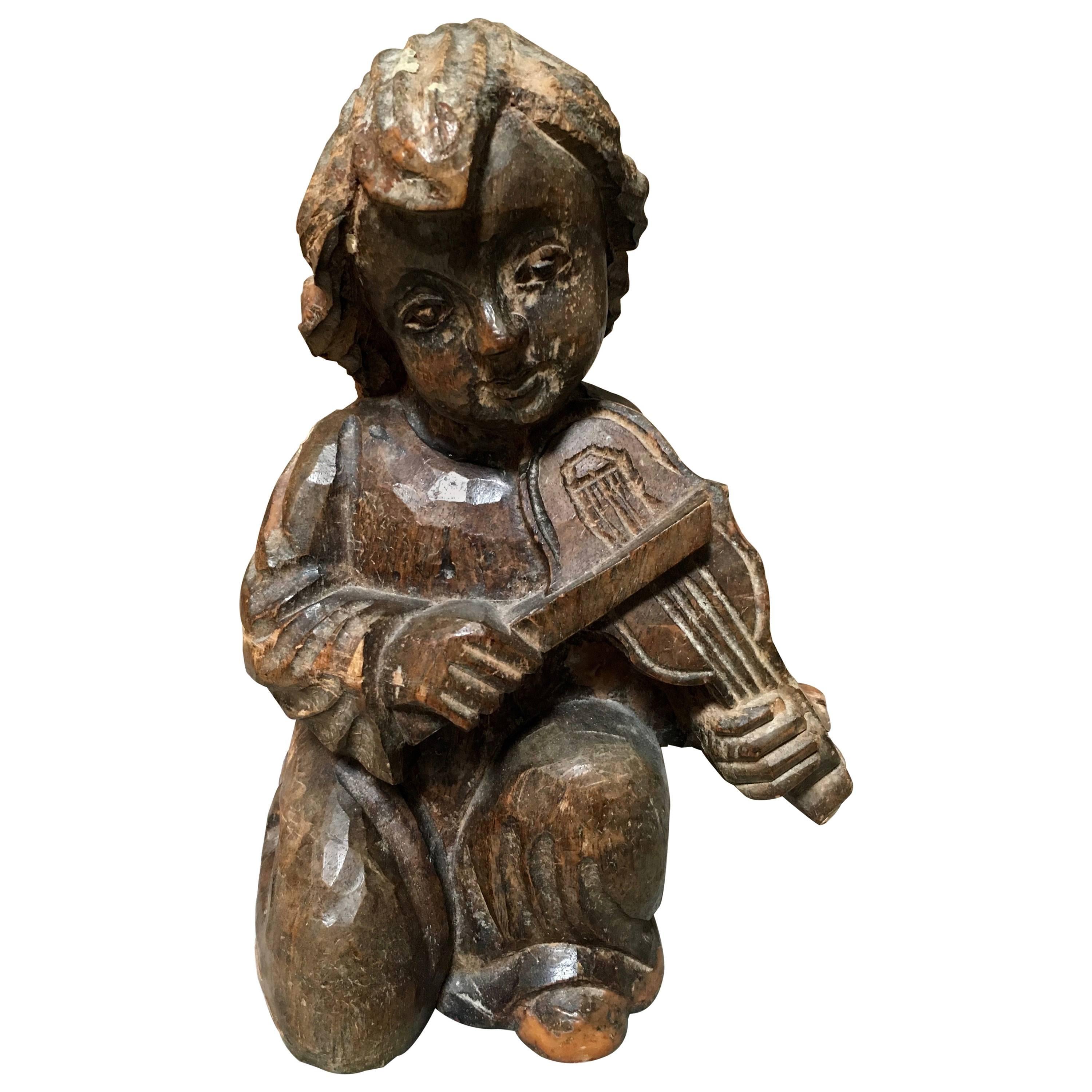 Handgeschnitzte Statue eines Violin spielenden Jungen aus dem 19. Jahrhundert