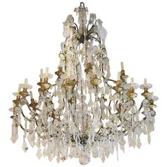Large Italian Mid-19th Century Chandelier in Gilt Iron, Giltwood and Crystal