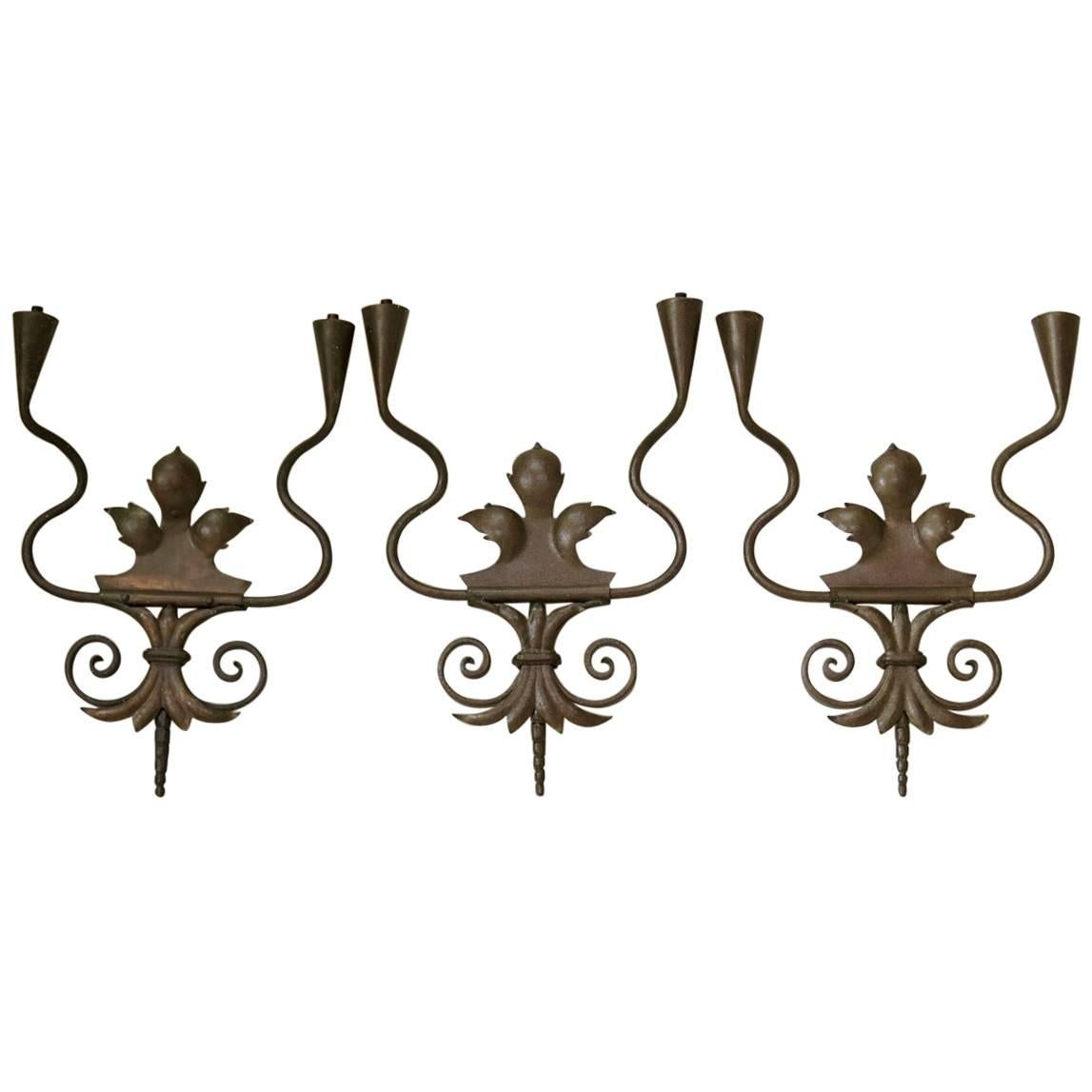 Set of three Coppered Iron Sconces, France, circa 1950s