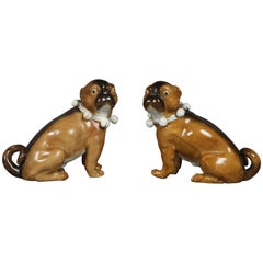 Pair of German Porcelain Figures of Seated Pugs