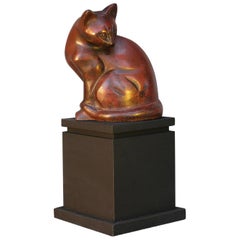 Modèle Art Déco d'un chat assis en bronze patiné, vers 1930