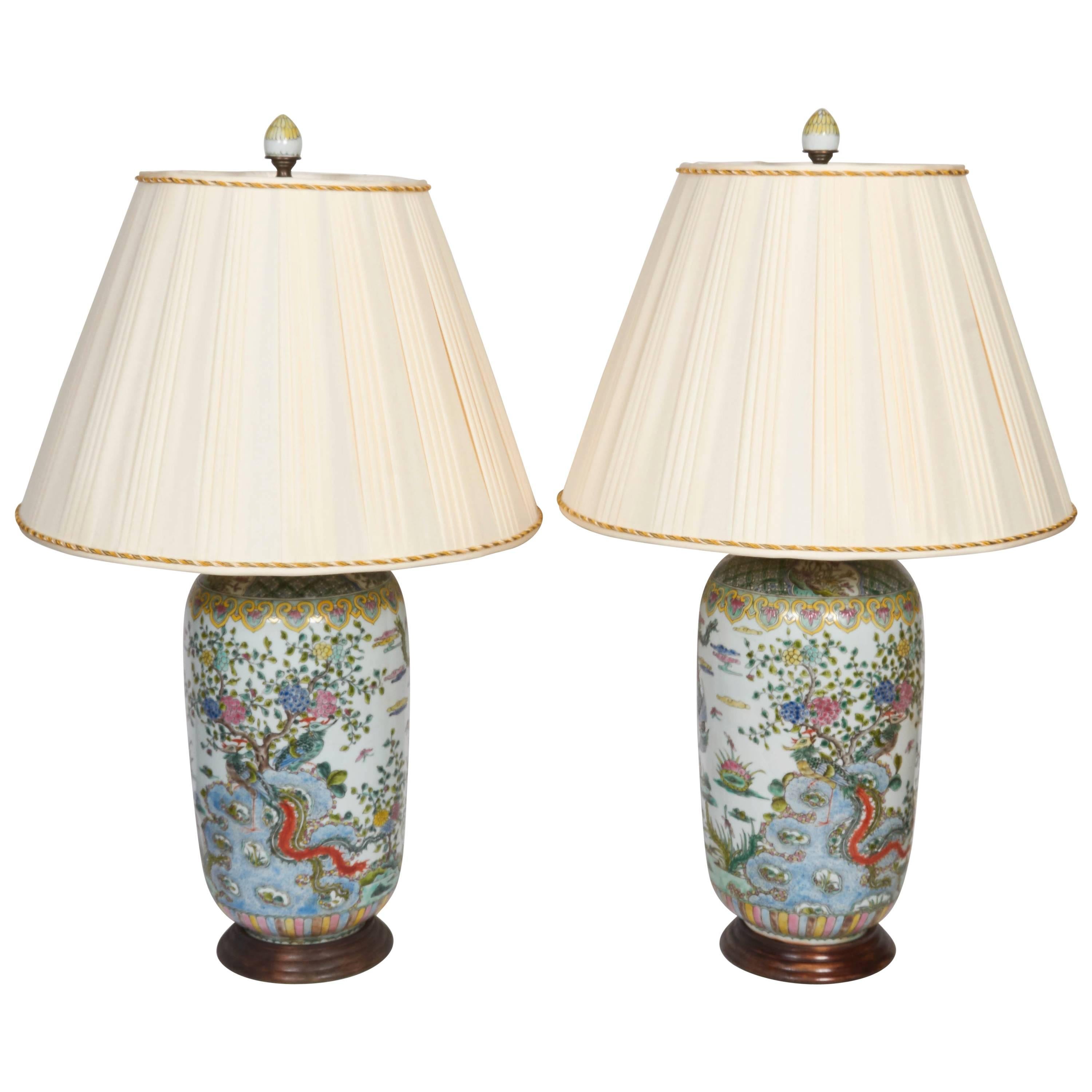 A pair of Chinese porcelain Famille Verte urns fitted as lamps